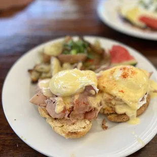 Classic eggs Benedict: eggs, apple wood ham, hollandaise, buttermilk biscuit