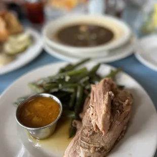 Slow roasted port, Pimento Cheese Grits, High Hat Boudin Chicken &amp; Andouille Gumbo Ya-Ya Bowl.