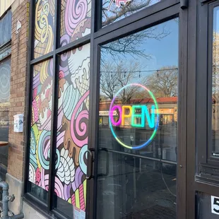 a neon sign in the window