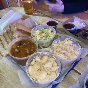 Sides of Mac n cheese, frijoles charros and coleslaw