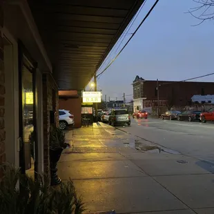 a wet sidewalk at night
