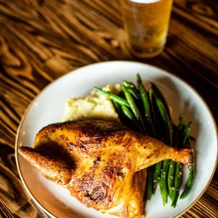 Roasted Half Chicken served with mashed potatoes and green beans