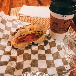 Bomb thrower with ham, bacon, onion, avocado, cheese and egg on an everything bagel and an almond latte! Yumm