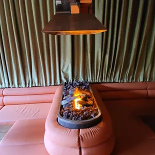 a fire pit in the middle of a living room