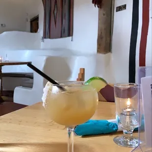 Down The Hatch Margarita, Corazon Silver Tequila, red chile simple syrup &amp; fresh lime juice.  in a glass rimmed with piñon salt. ​