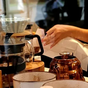 a woman pouring coffee