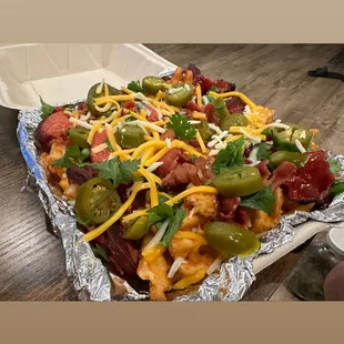 a tray of chili cheese fries