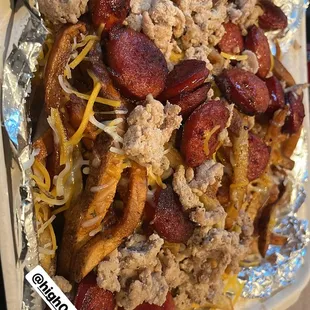 a tray of loaded loaded with meat and cheese