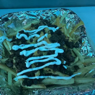 a plate of french fries with ketchup