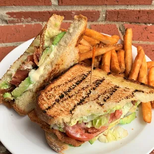 Avocado BLT on white toast with French Fries