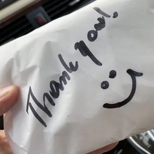 She puts a smiley face or thank you or sometimes both on every wrapped sandwich!