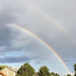 Double rainbow from the parking lot right outside the doors to High Rise Pizza Kitchen.