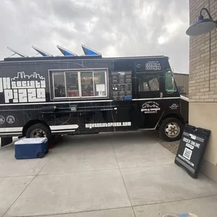 a food truck parked in front of a building