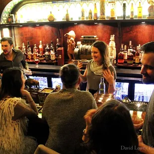 a group of people at a bar