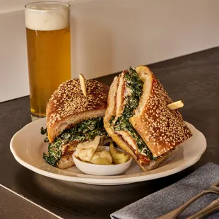 a sandwich and a glass of beer