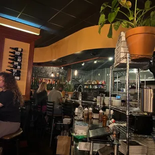 a woman sitting at a bar