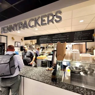 people standing in line to order food