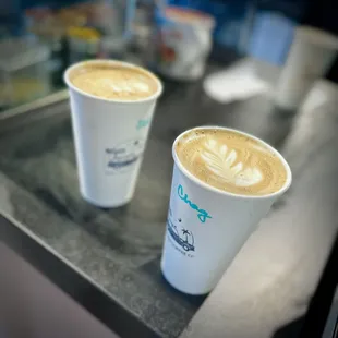 two cups of coffee on a table