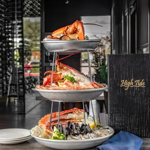 a three tiered display of seafood