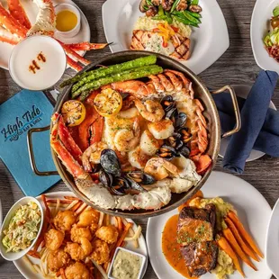 a variety of seafood dishes on a table