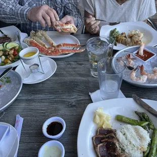 Filet mignon and king crab (top left), halibut special (top right), ahi tuna (bottom right)