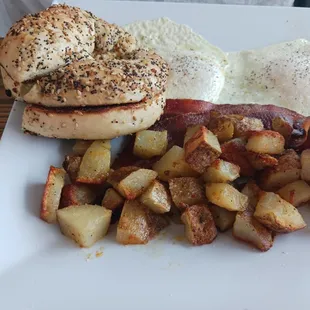 My hubby's fave, the Super Dude ... 2 eggs made your way, 2 slices of bacon, home fries, your choice of bagel, this is the Everything Bagel