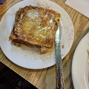 a plate of french toast on a table