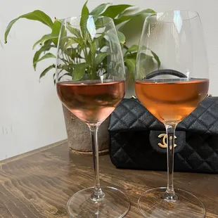 two glasses of wine on a table