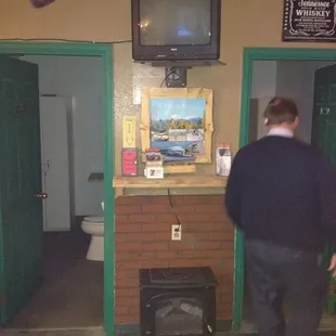 a man standing in front of a tv