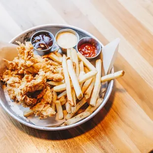 a plate of fried chicken and french fries
