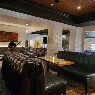 a dining area with tables and chairs