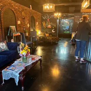 a woman standing in a coffee shop