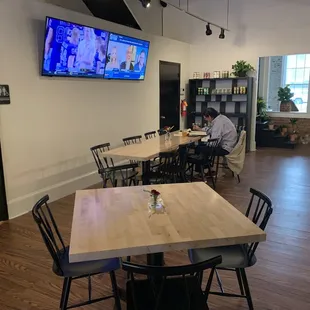 a man sitting at a table in a restaurant