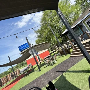 a dog sitting on a lawn