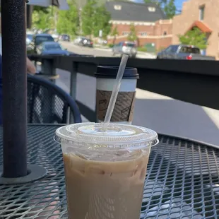 a cup of iced coffee on a table