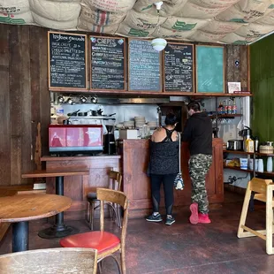 two people standing at the counter
