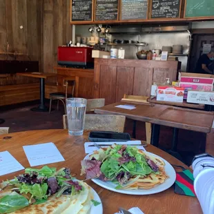 Shrimp Crepe: tomato sauce, tomato, mushrooms, caper garlic sauce, mozzarella cheese, and lemon. Served with arugula salad and potatoes.