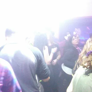 a group of people dancing at a party