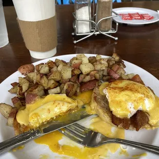 a breakfast of eggs, potatoes, and hash browns