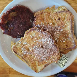 Gluten free french toast with a sausage patty on the side
