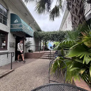 a man standing in front of a coffee shop