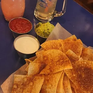 Chips, salsa, guacamole and jalapeño ranch sauces