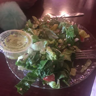 a plate of salad with dressing