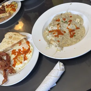 Biscuits &apos;n&apos; Gravy with two eggs and bacon