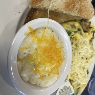 Mushroom spinach and cheese omelet with grits of the day