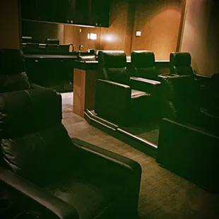 Featured here is the "Living Room," which can seat 10 people in recliners, with an additional 4 bar stools at the bar, in the back.