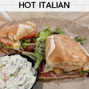 a sandwich with a side of dip