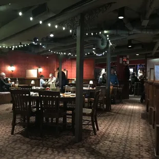 Dining room décor dark and English tavern like, very cool.