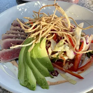 Delicious seared ahi salad with fresh avocado, and seaweed salad!