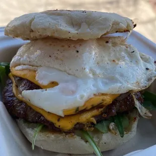 a burger with an egg on top